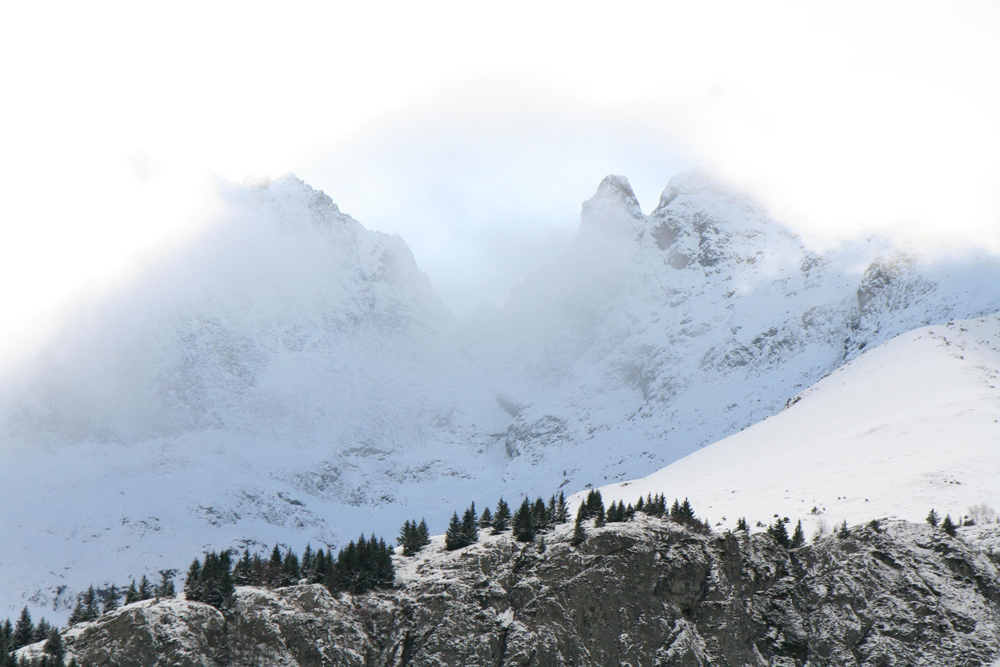 An extraordinary blue light through the clouds, Ecrins Massif